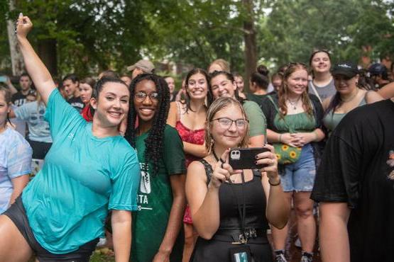 A group of students smiles at the camera in Athens at Ohio University